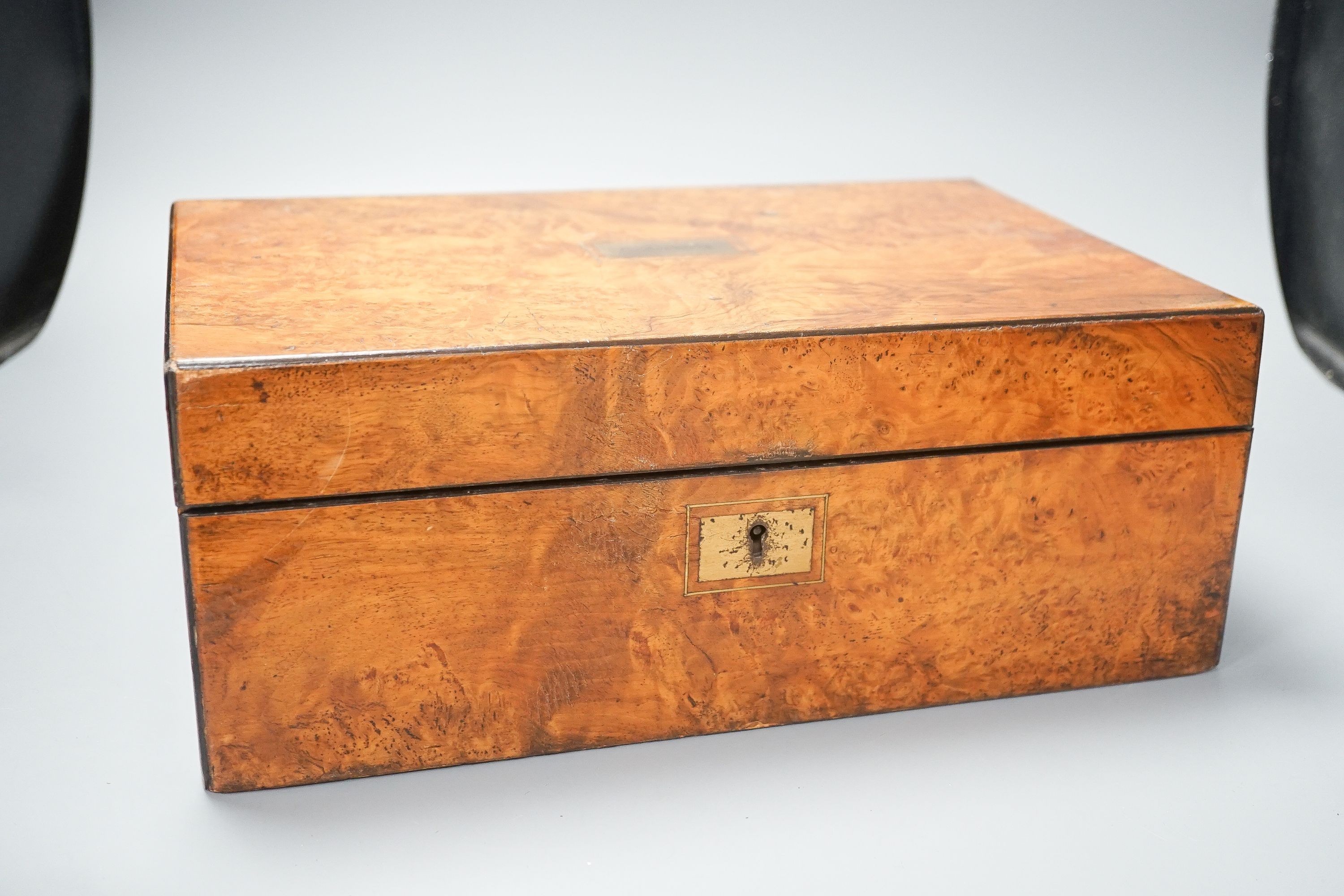 A Victorian burr walnut and leather writing slope, inlaid plaque for ‘C.Roberts’, 36 cm